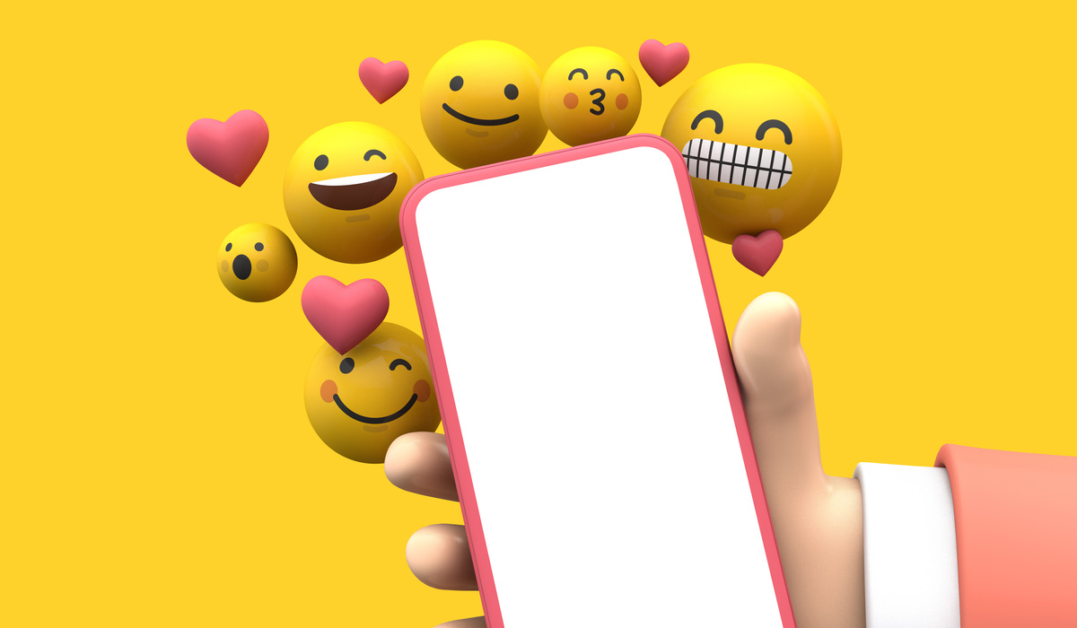 3D Hand with Smartphone and Emojis on Yellow Background